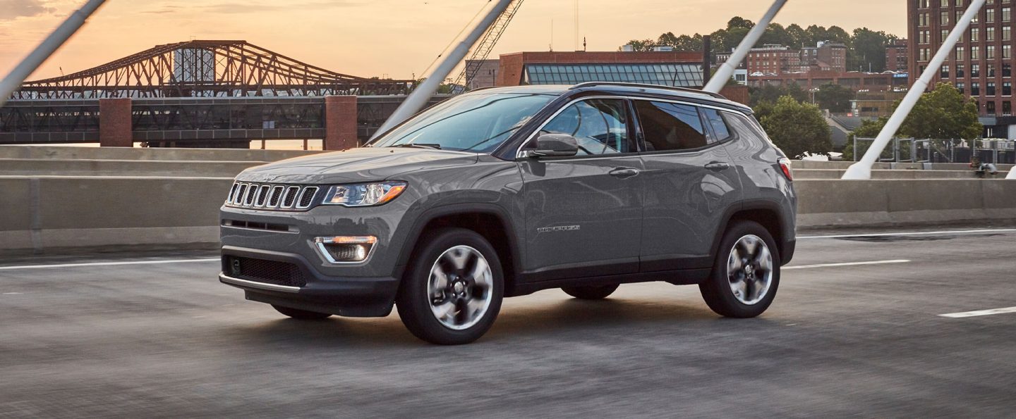 The 2021 Jeep Compass parked on an overpass.