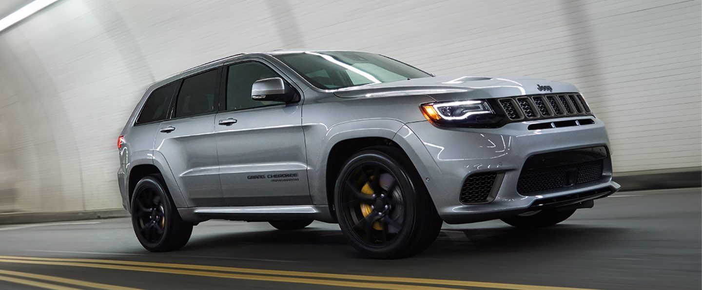 The 2021 Jeep Grand Cherokee Trackhawk being driven through a tunnel.