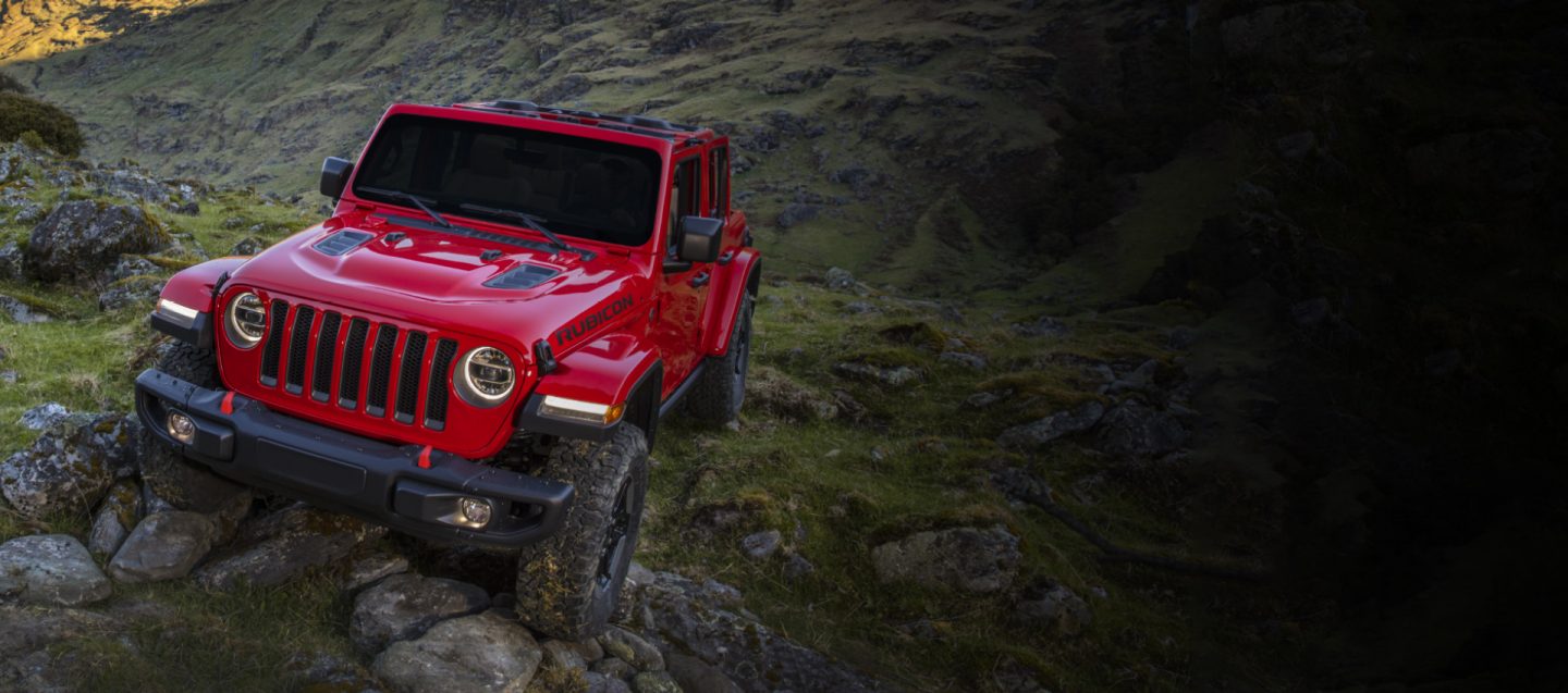 The 2021 80th Anniversary Jeep Brand lineup parked on a grassy autumn terrain, front row: Wrangler 80th Anniversary, Grand Cherokee 80th Anniversary and back row: Compass 80th Anniversary, Cherokee 80th Anniversary, Gladiator 80th Anniversary, Renegade 80th Anniversary.